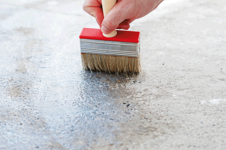Coating the concrete floor with a brush. Can You Color Exposed Aggregate