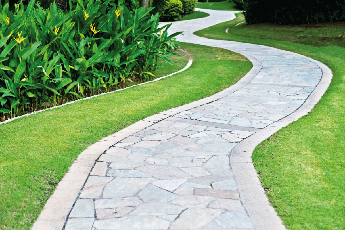 Curved path in the formal garden made with flagstones
