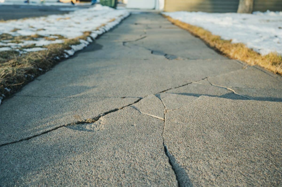 Frost heave crack in residential concrete sidewalk
