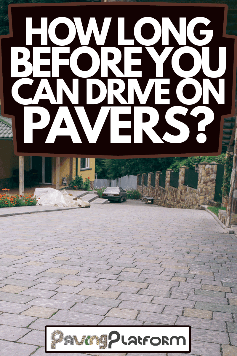 Nested pavers of various colors, around the grass is green, chic garden, How Long Before You Can Drive On Pavers?