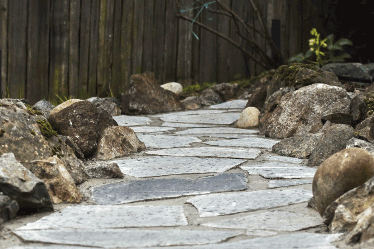 Natural Flagstone pathway with a few drops of rain. Is Flagstone Durable [And How Long Does It Last]
