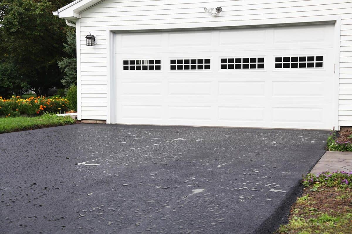 New residential home blacktop asphalt driveway was completed