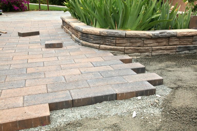Newly installed brown brick texture concrete pavers, Do Pavers Get Hot? [Including Bluestone, Travertine, Brick, Rubber, & More!]