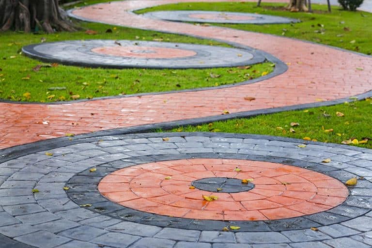 Painted concrete paver walkway in the park, Can You Paint Concrete Pavers? [Including How To Stain]