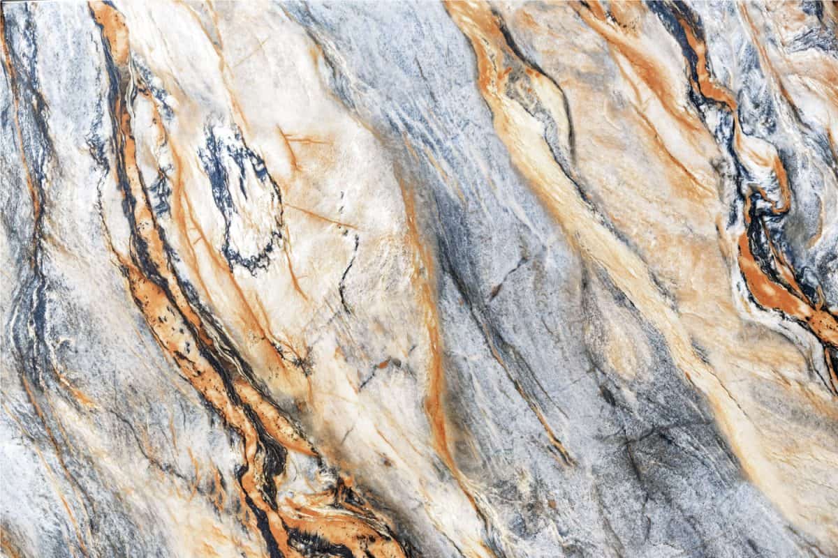 Quartz stone with gray and brown patterns. Background and texture of natural quartzite.