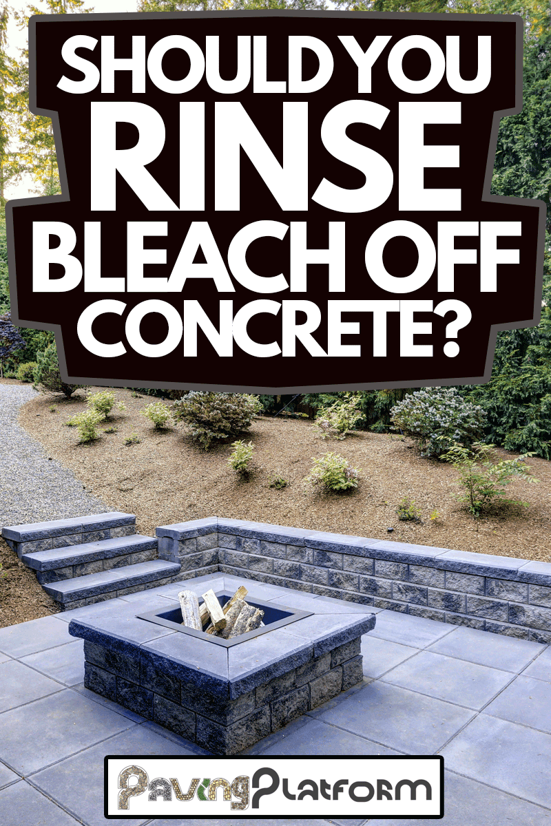 New modern home features a backyard with rectangular concrete fire pit framed by slate pavers and overlooking the lush garden, Should You Rinse Bleach Off Concrete?
