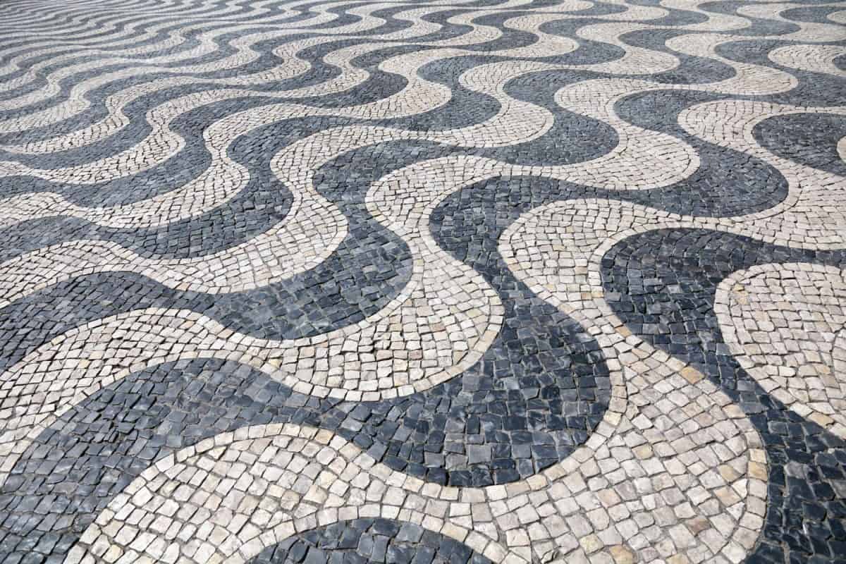 Swerving lines of small tiled stone patterns