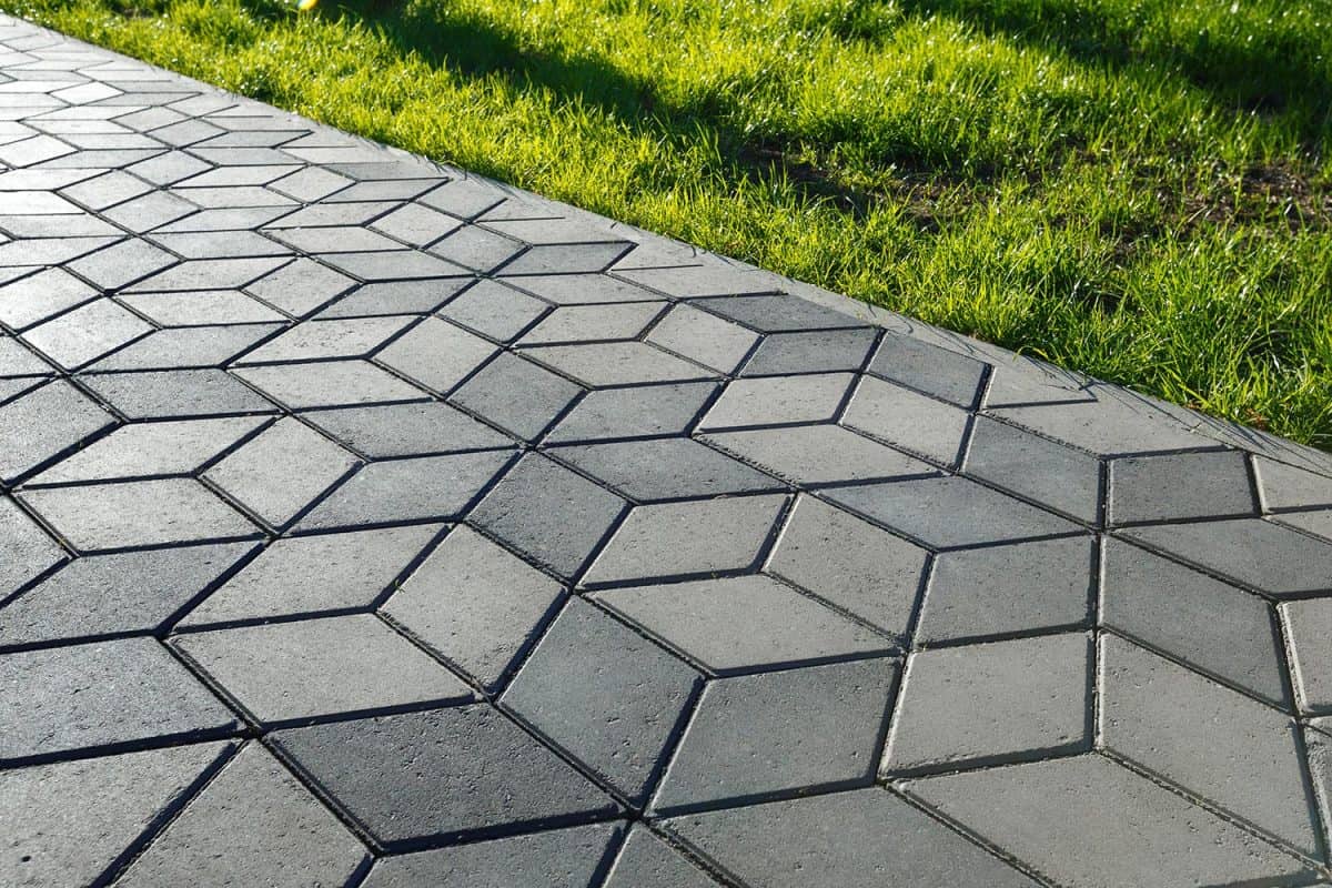 The footpath in the park is paved with diamond shaped concrete tile