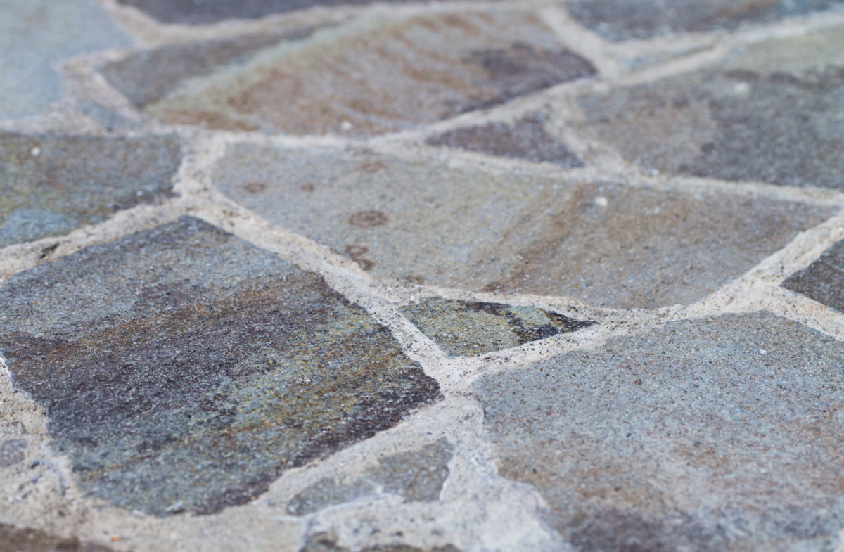 A Flagstone Patio shot at an angle fading into a blurred background