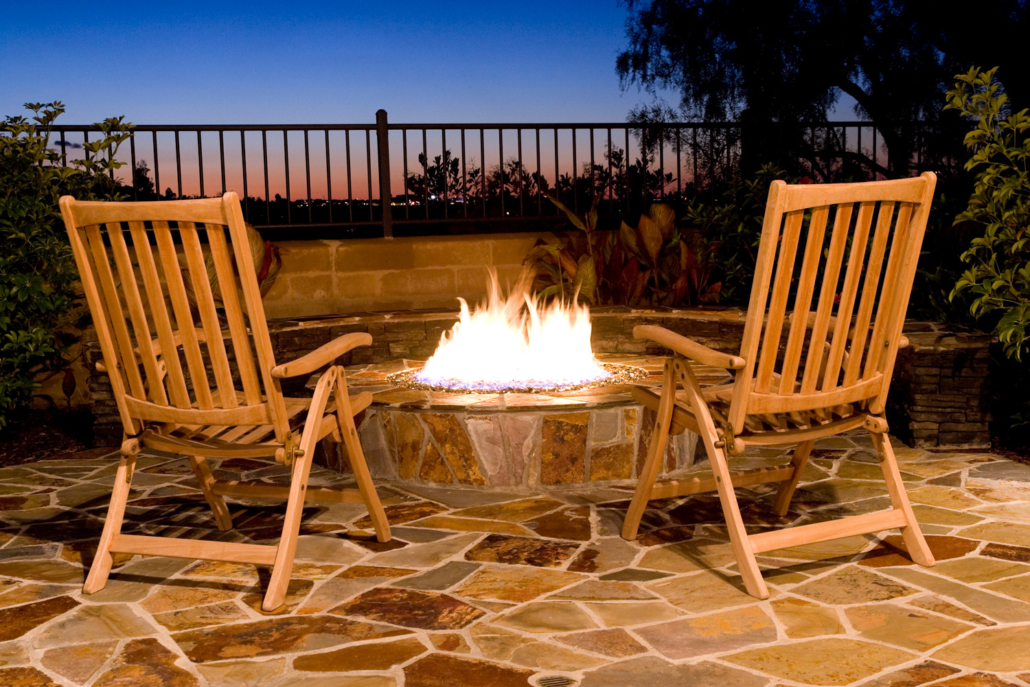 A beautiful firepit in the back yard makes for relaxing luxury. Comfortable seating areas for good conversation.