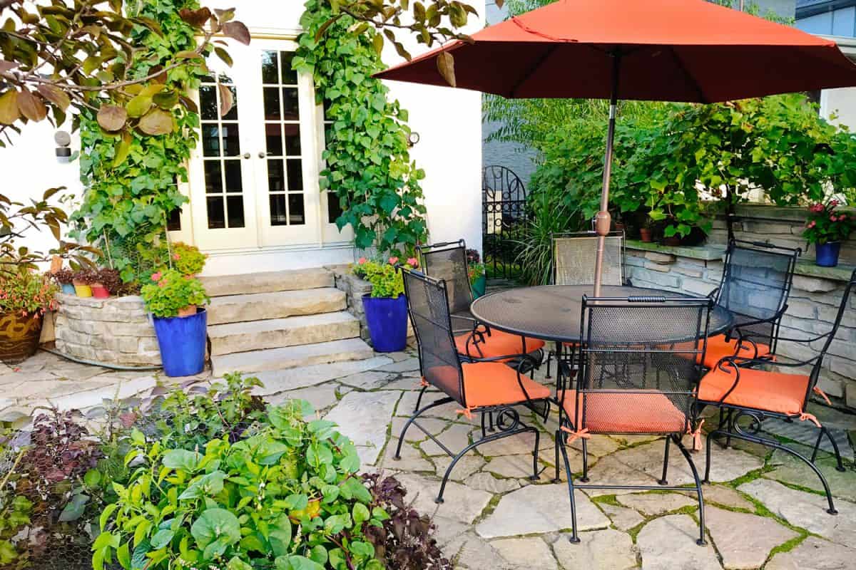 beautiful outdoor garden with tables and chairs