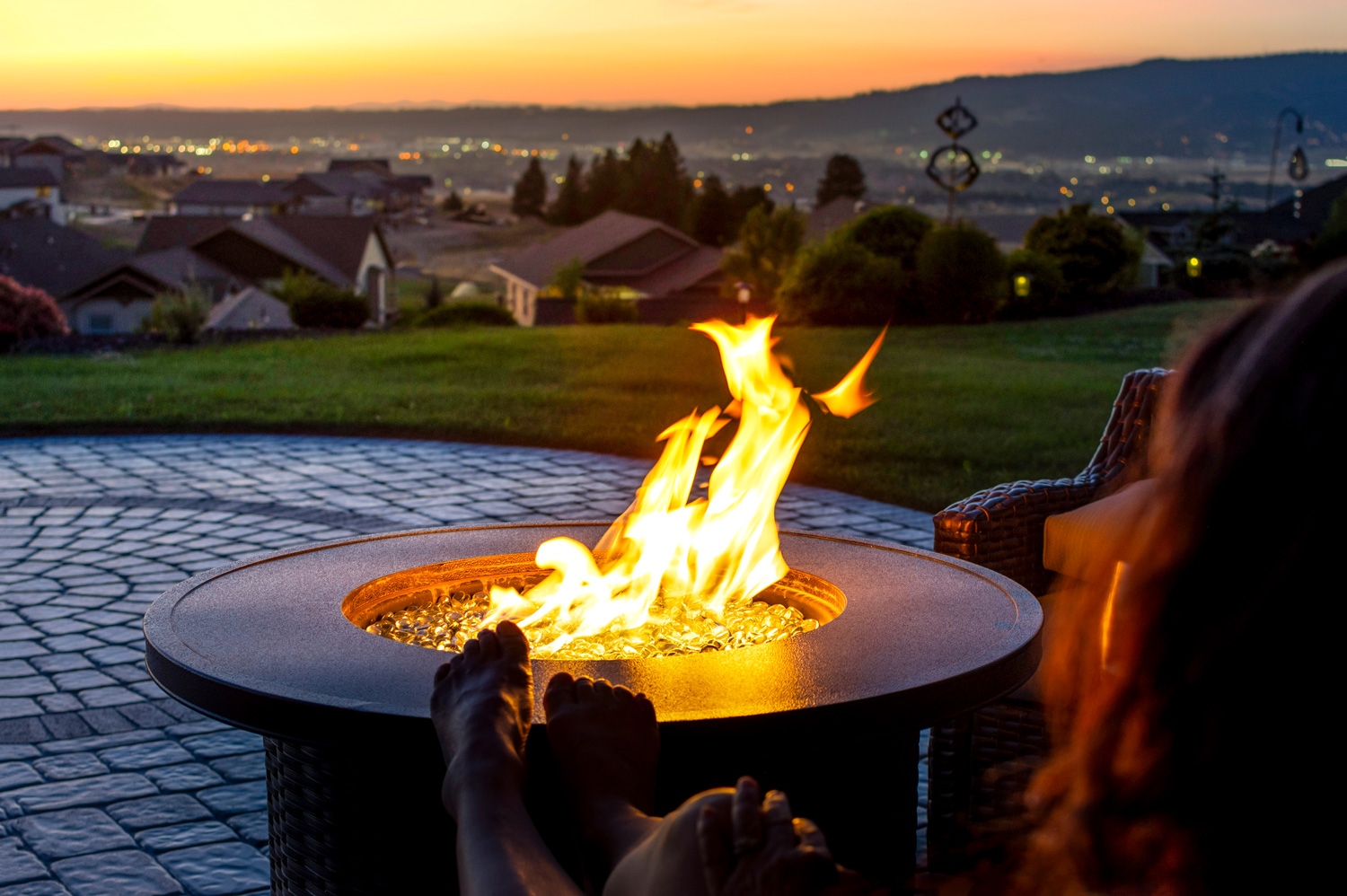 Outdoor fire pit with roaring fire.