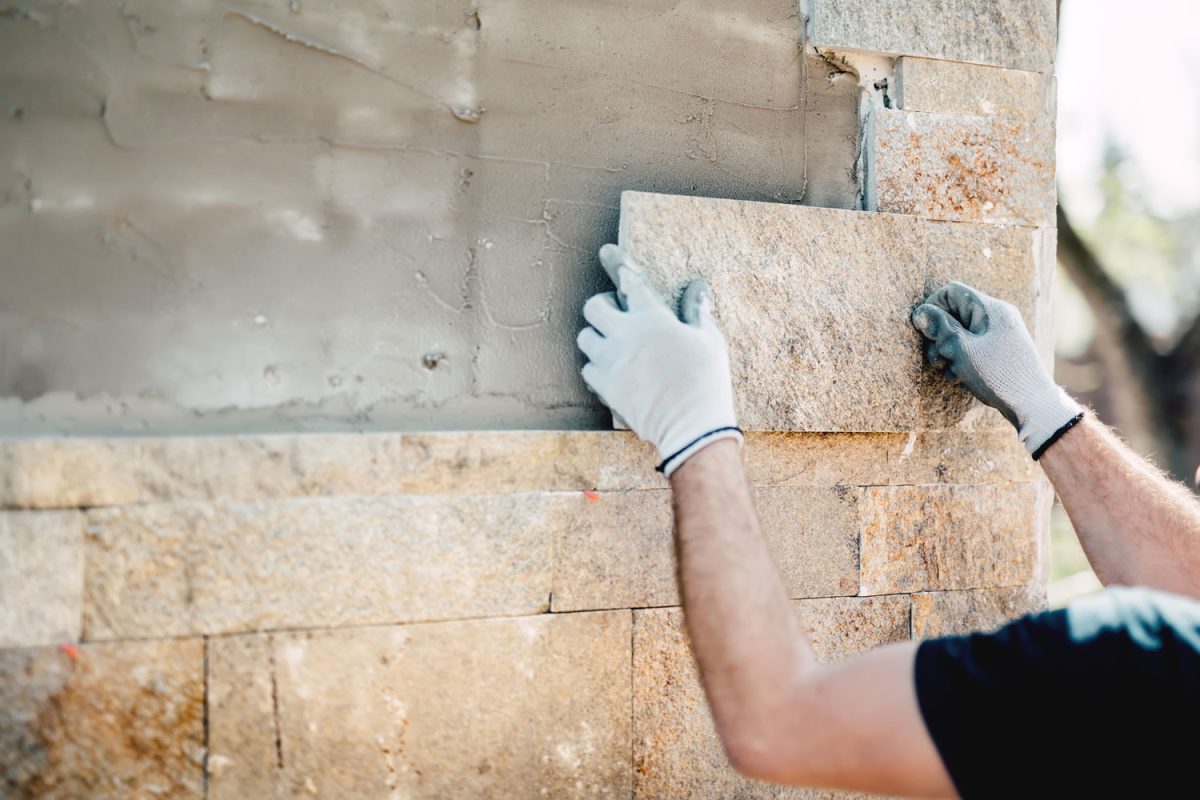 Applying paver limestone on walls