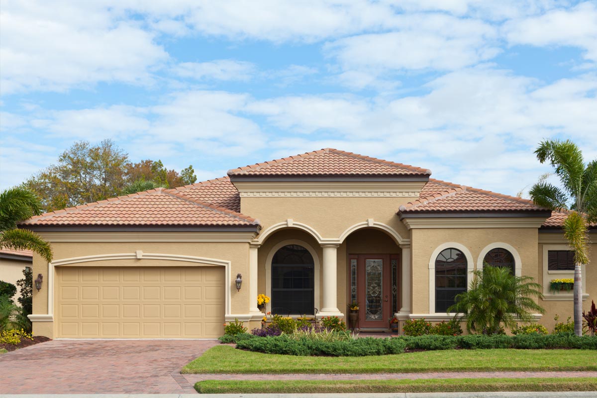 A beautiful luxurious house with nice landscaping, What Color Pavers Go With A Beige House?