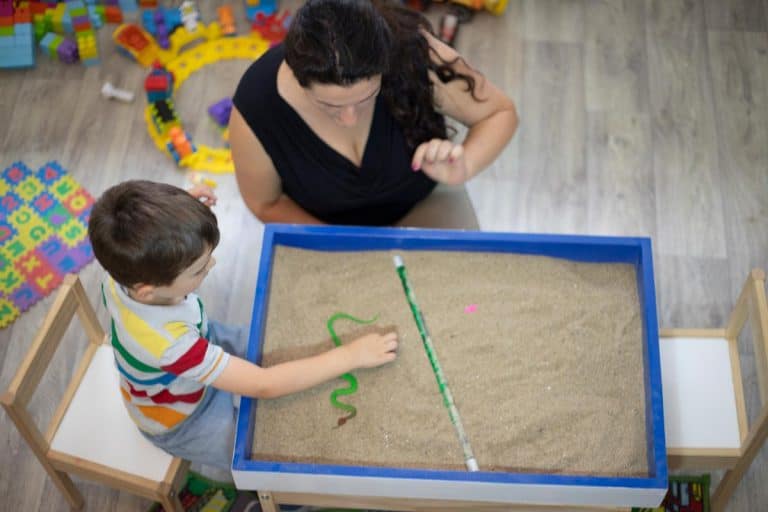 A boy playing in the sandbox at the psychotherapy session, Can You Use Play Sand For Paver Joints?