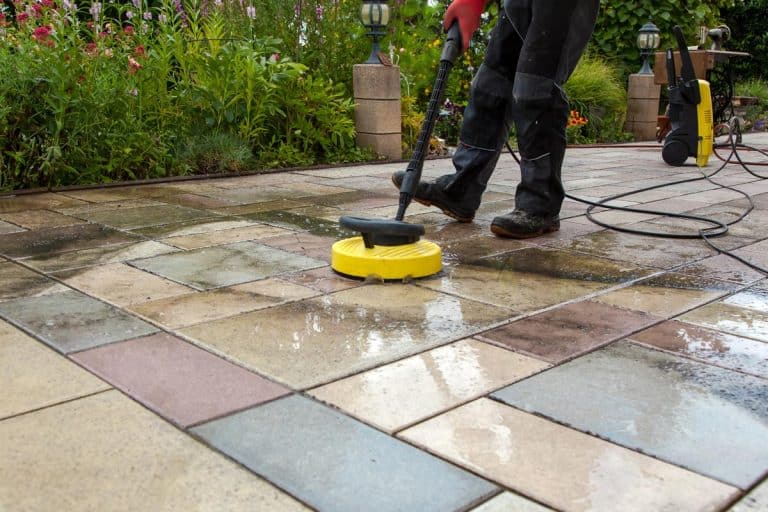 Cleaning a stone slabs on patio with the high-pressure cleaner, How To Keep Joint Sand From Washing Away