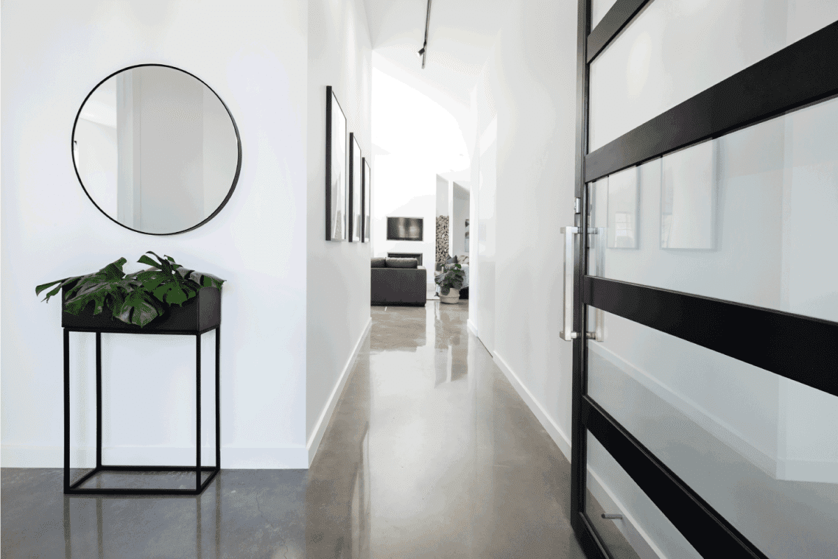 Contemporary home entry hall with polished concrete floors