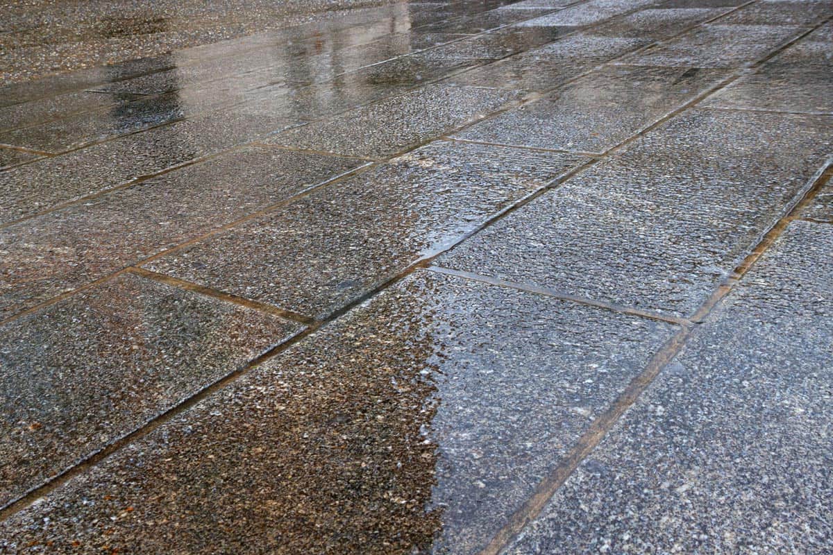 Dark pavement in rain time