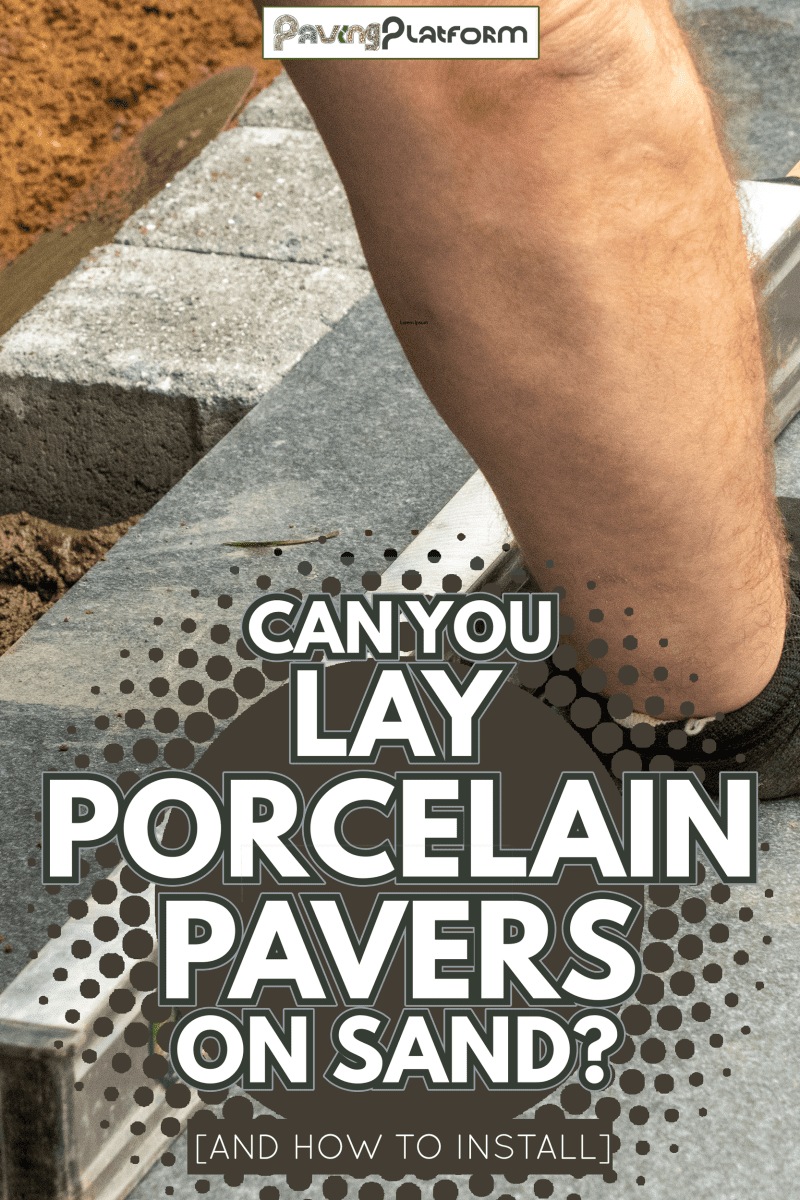 Expert workman laying patio edging bricks in garden makeover - Can You Lay Porcelain Pavers On Sand [And How To Install]