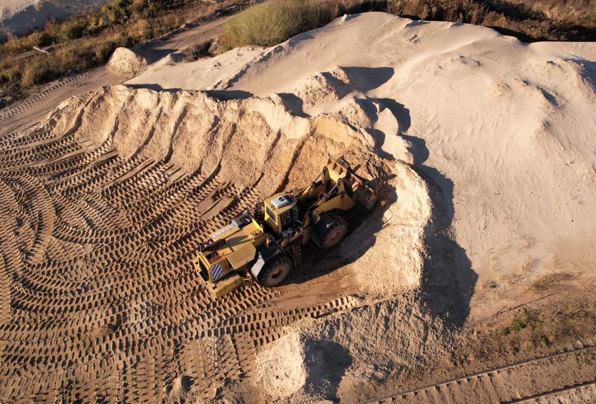 Front-end loader during digging and excavation operations in open pit