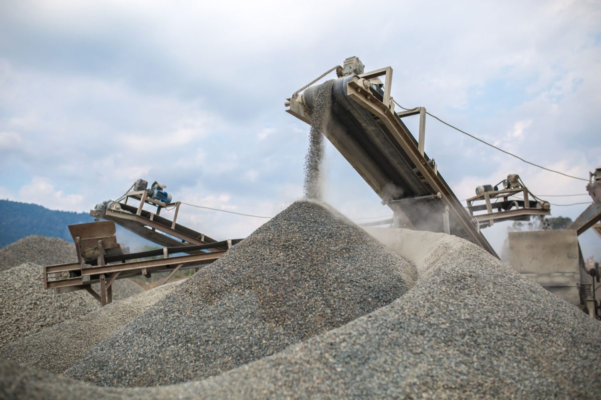 Gravel being separated using a conveyor