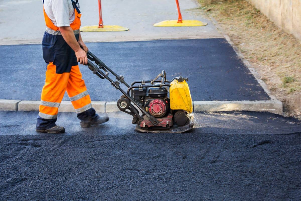 Leveling the surface of the an asphalt installed on road
