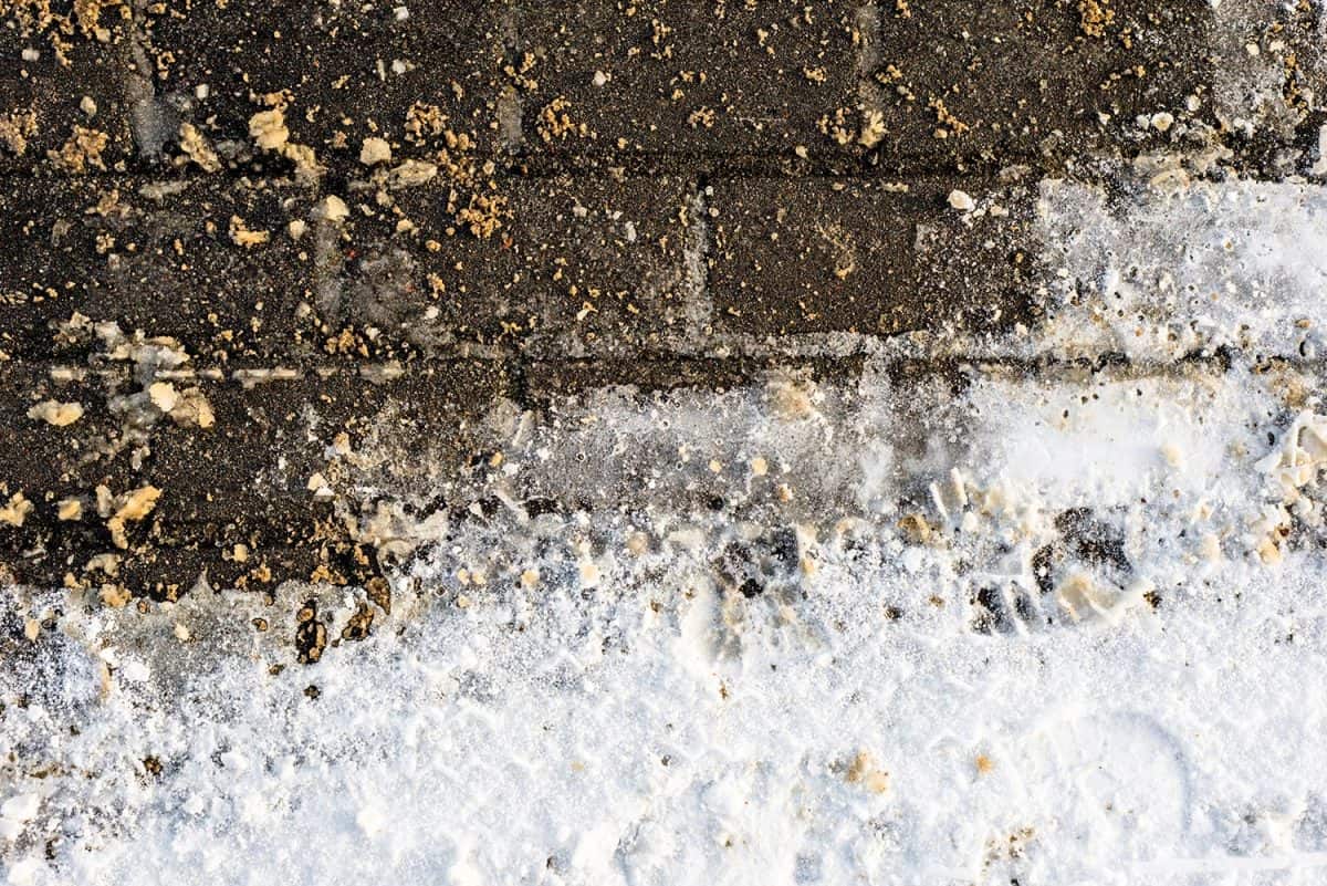 Melting snow on paving in winter