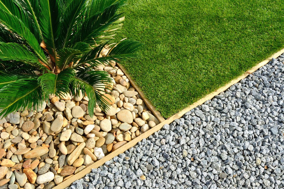 Modern landscaping using gravel, concrete borders and plants