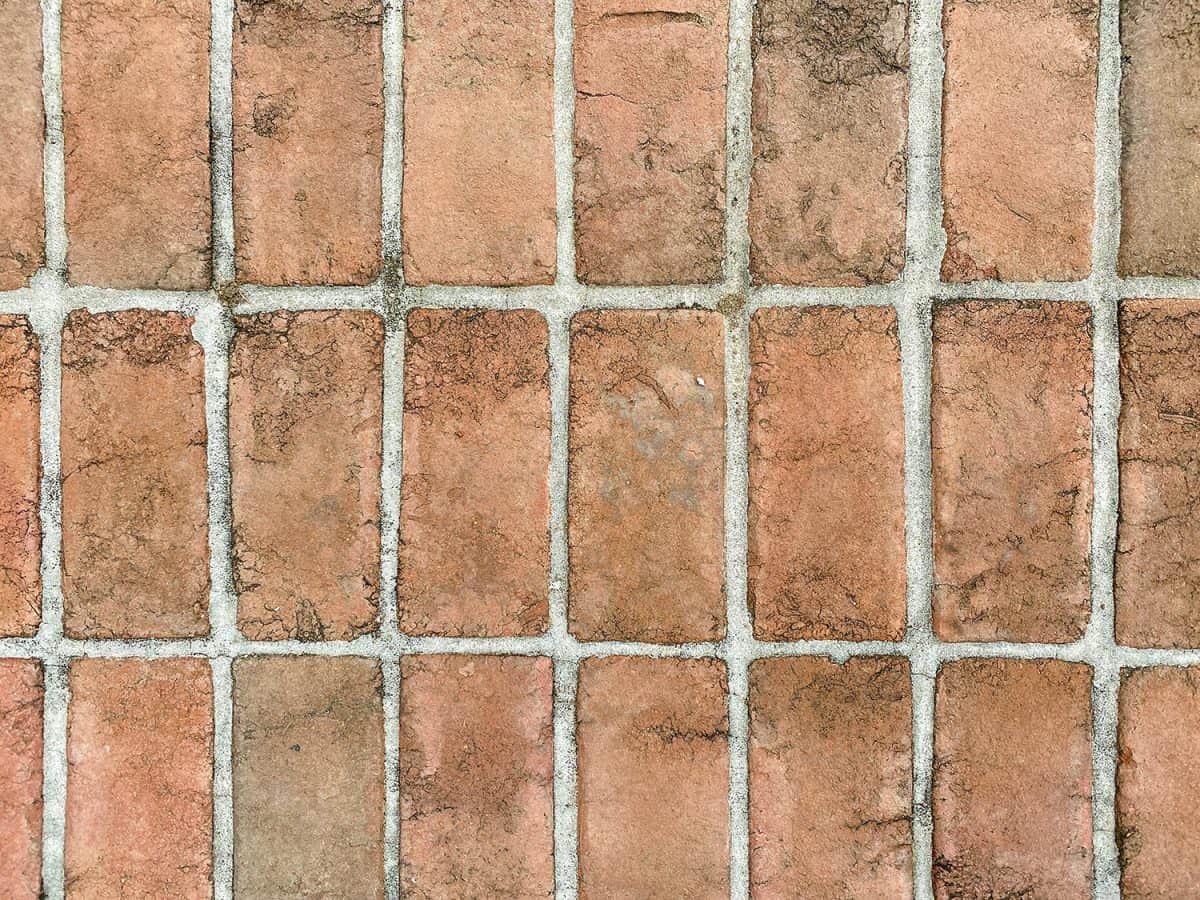 Old vintage cobblestone red brick paver stone walk driveway 