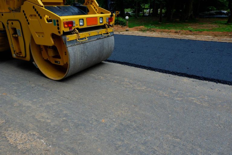 A road roller repairing the asphalt pavement, Can You Put New Asphalt Over Old Asphalt?