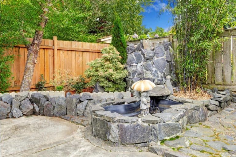 A rocky fountain with sculpture, Best Time of Year To Start Your Hardscaping Projects
