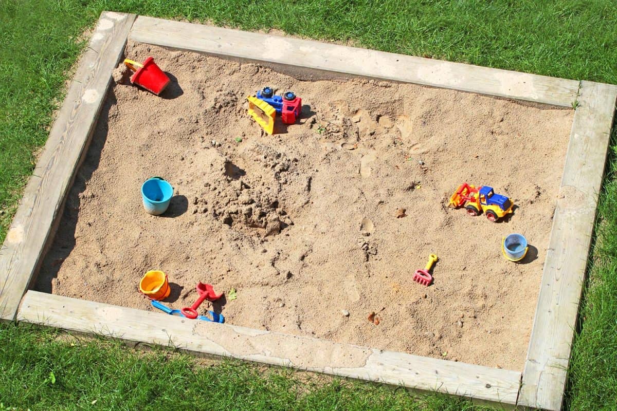 Sandbox with plastic toys