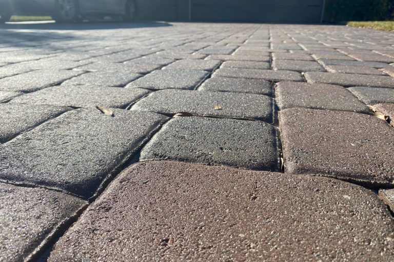 Smooth Sealed Concrete Paver Closeup, Can You Pour Concrete Over Pavers? [Including Brick And Flagstone]