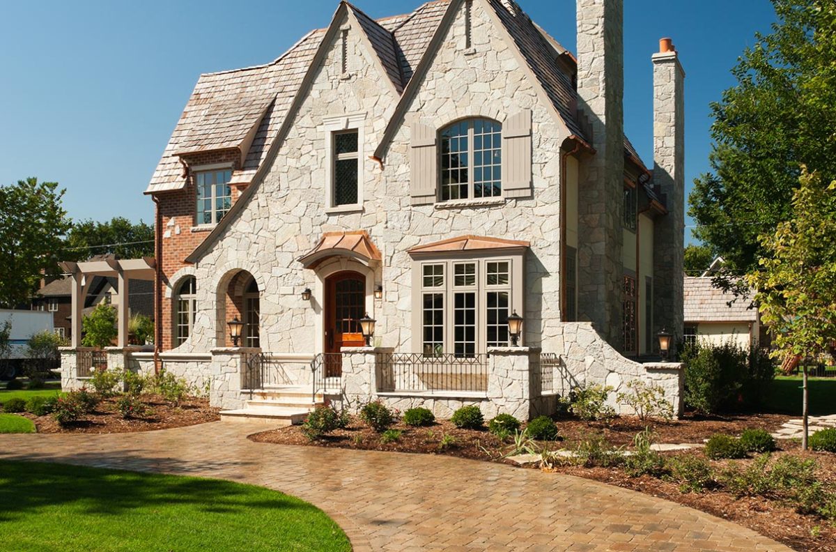 Suburban mansion with paver driveway