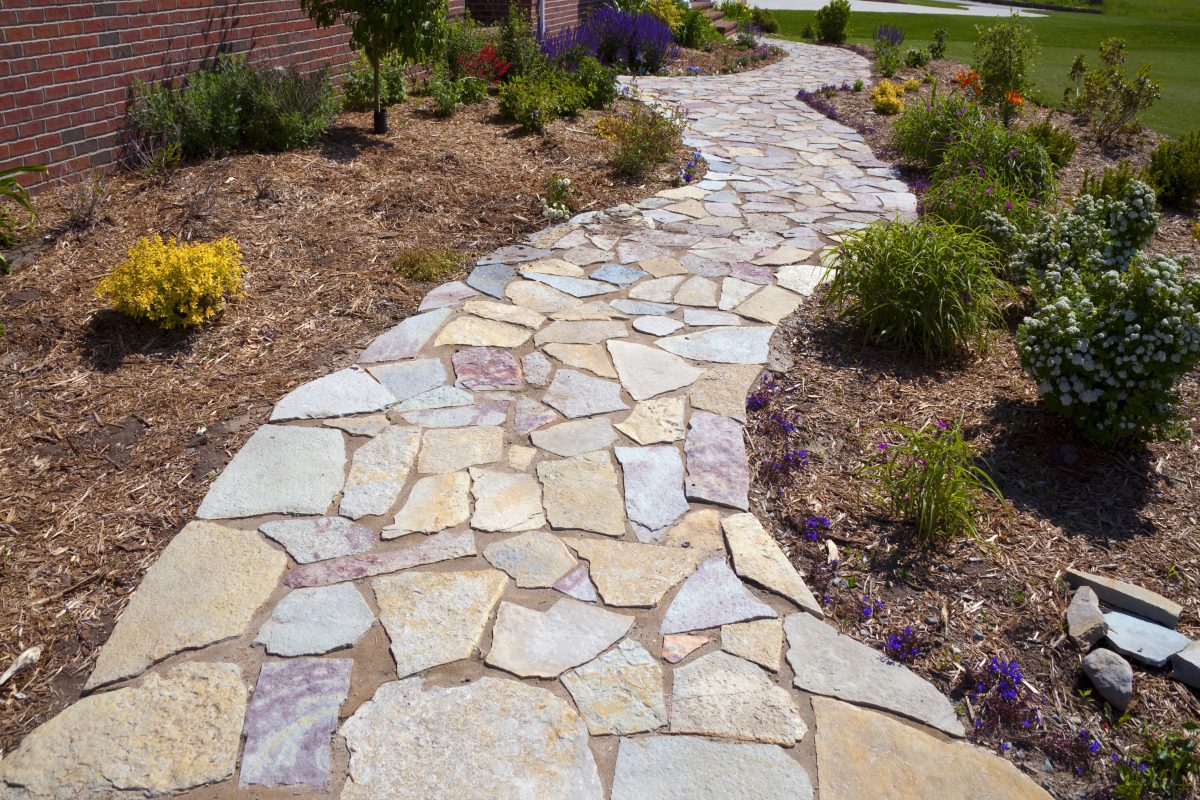 Colorful natural paved field stone sidewalk
