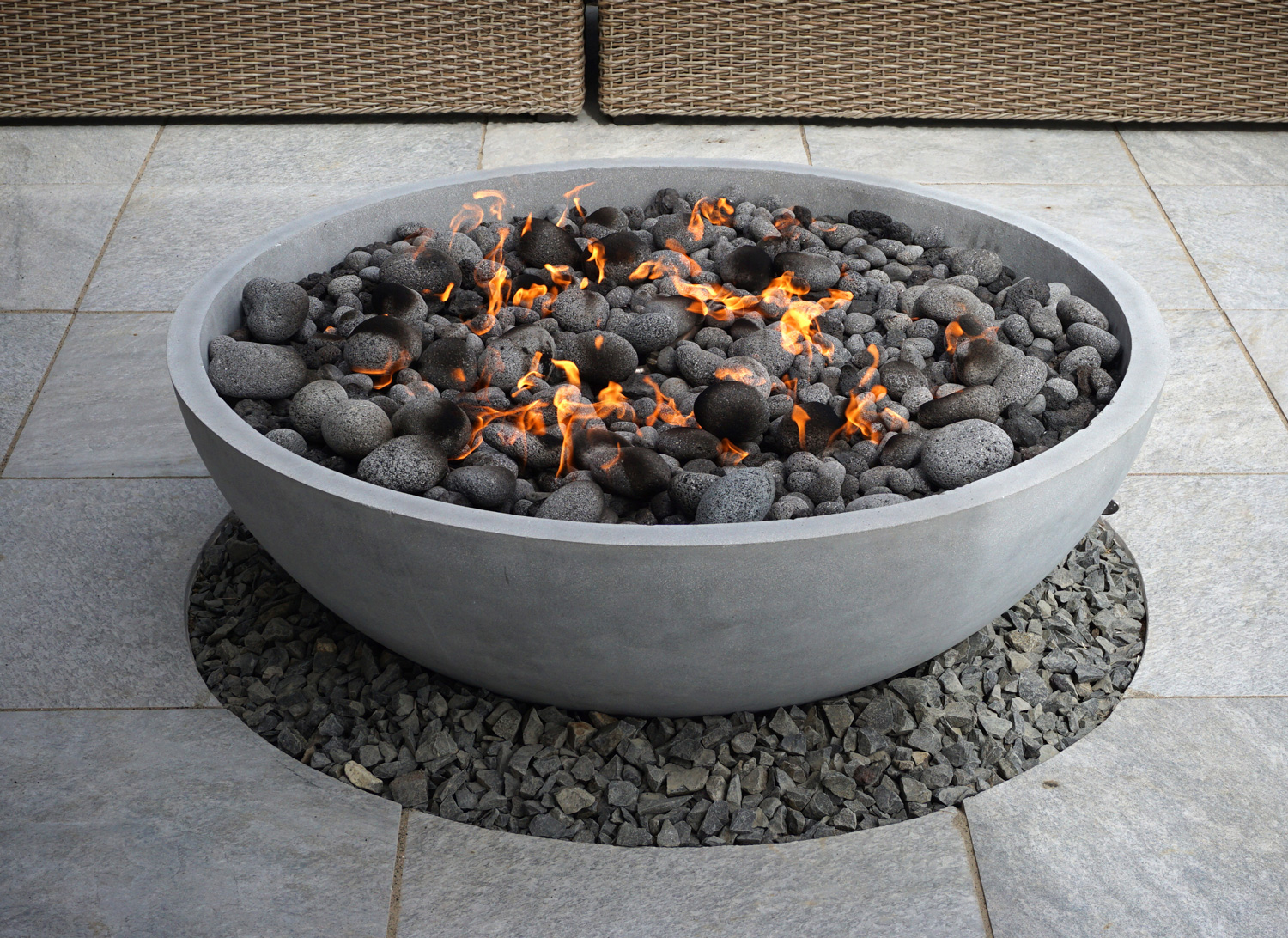 modern fire pit on backyard patio