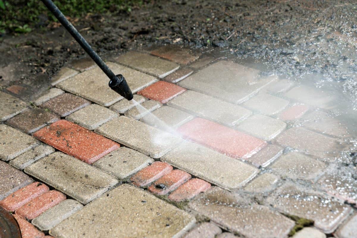 washing services - block paving cleaning with high pressure washer - Can You Pressure Wash Travertine Pavers? [Best Cleaning Methods]