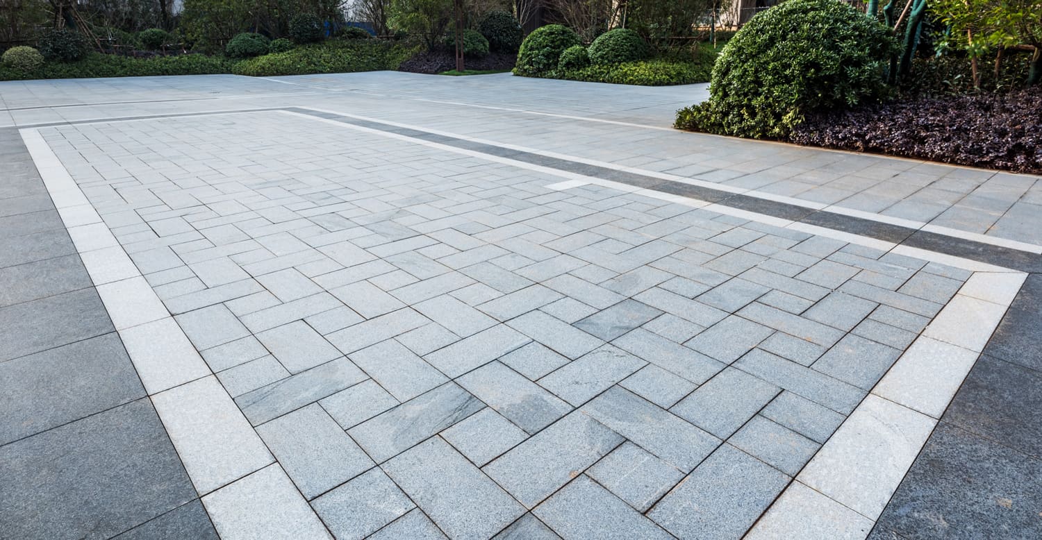 Grey marble floor tiles on garden square in residential area