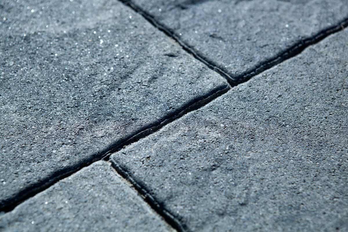 city rectangular gray paving tiles close up

