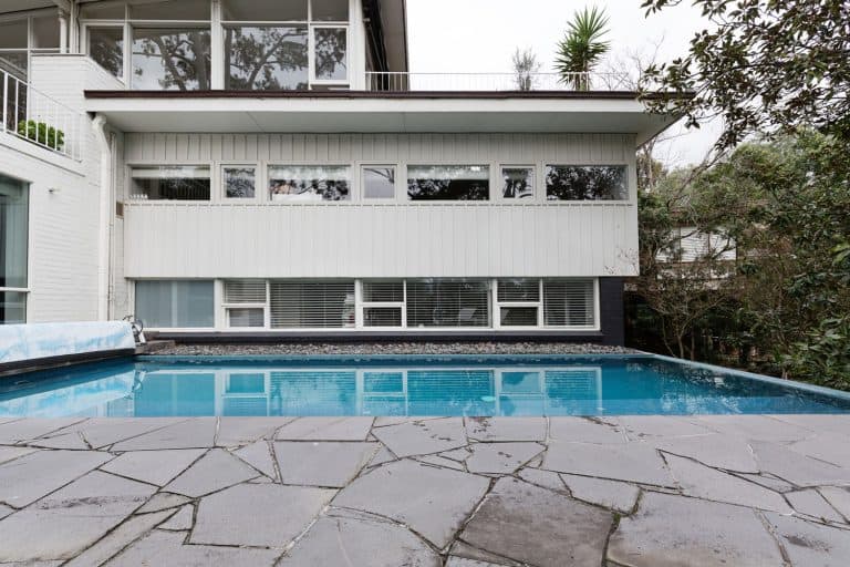 Swimming Pool with bluestone paver installed as sidewalk, Can You Lay bluestone pavers over concrete? and how to
