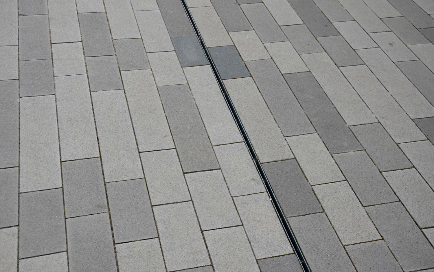 large, format, paving, gray, granite, water, drained, rain, through, slotted, slot, stainless, channel, drain, drainage, steel, under, surface, tile, design, overall, look, noticeable, cleaning, element, rectangular, wet, rainy, straight, gap, crack, tiles, pavement, construction, detail, block, paved, floor, outdoor, square, road, street, stone, asphalt